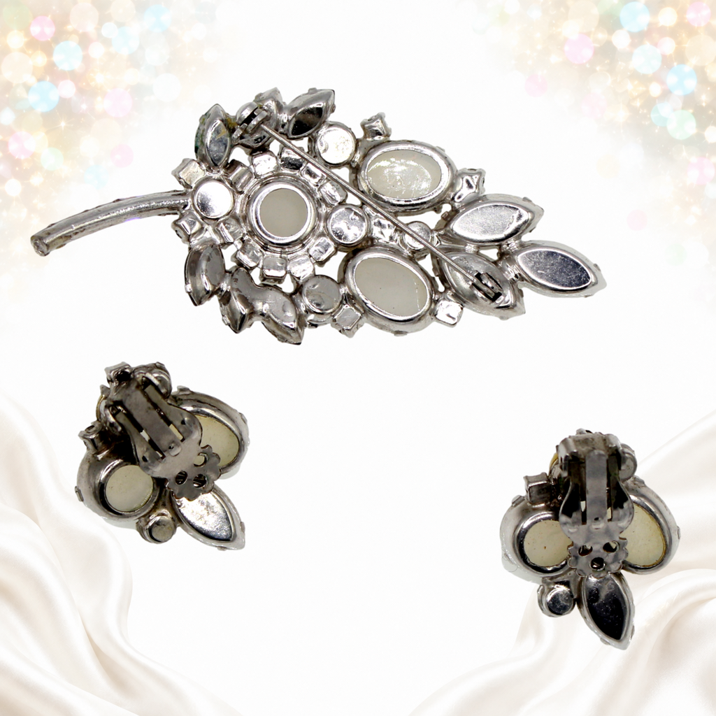 Reverse of Juliana leaf brooch and clip earrings showing silver-tone construction and fasteners