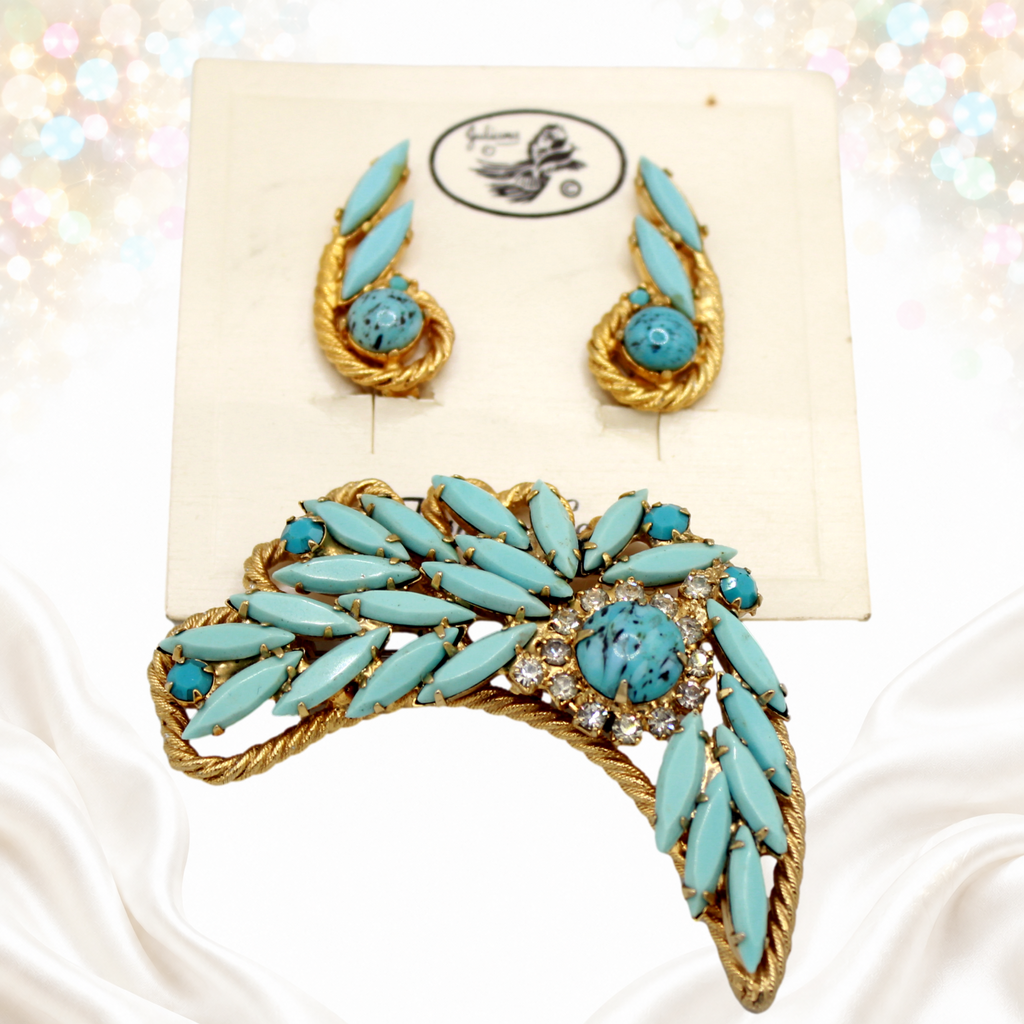 Angled view of vintage Juliana turquoise-color navette brooch and clip earrings with twisted gold-tone rope details