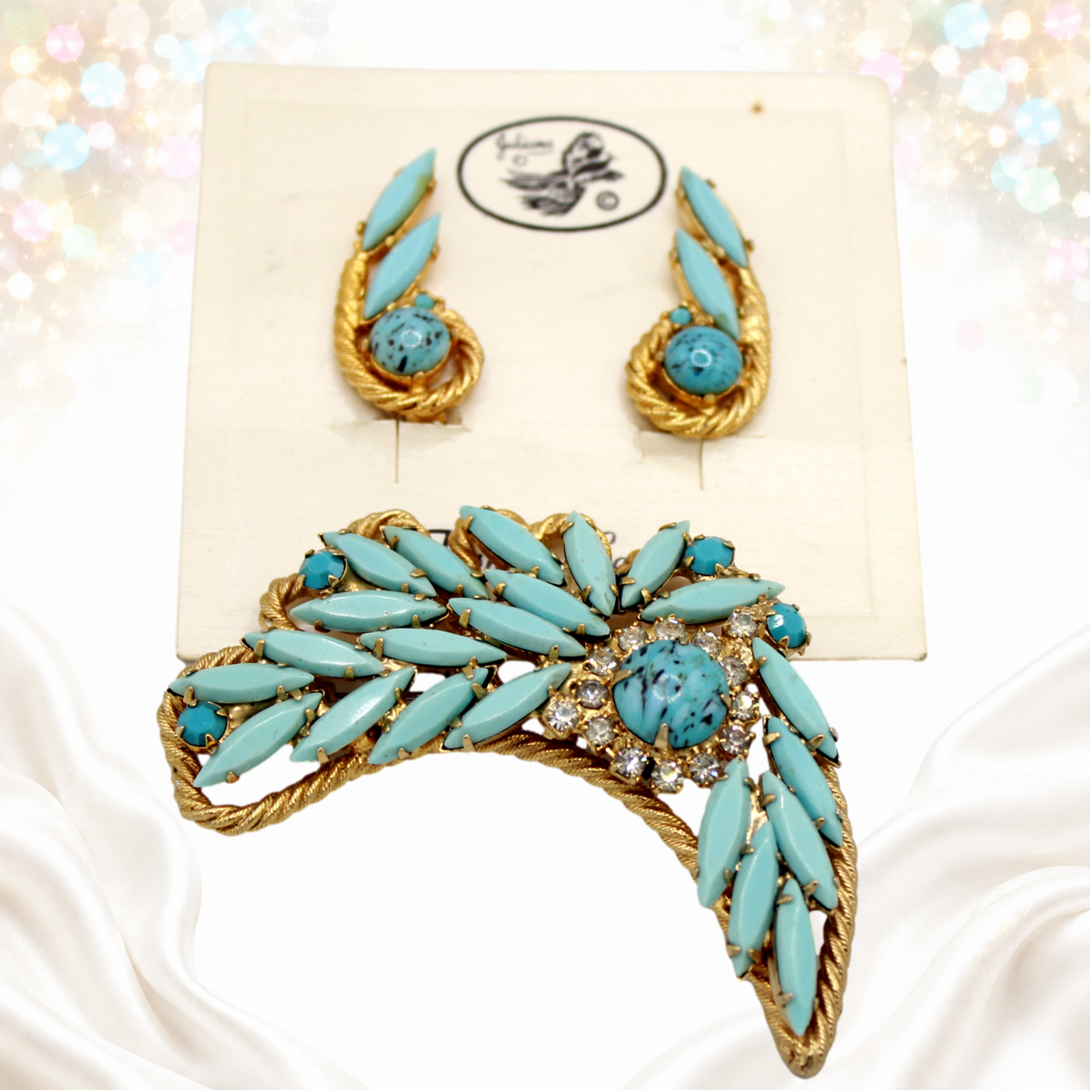 Angled view of vintage Juliana turquoise-color navette brooch and clip earrings with twisted gold-tone rope details