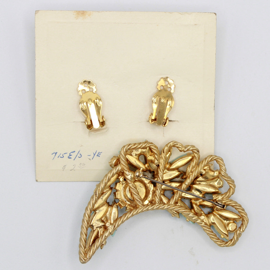 Reverse of vintage Juliana turquoise-color brooch and clip earrings on original card