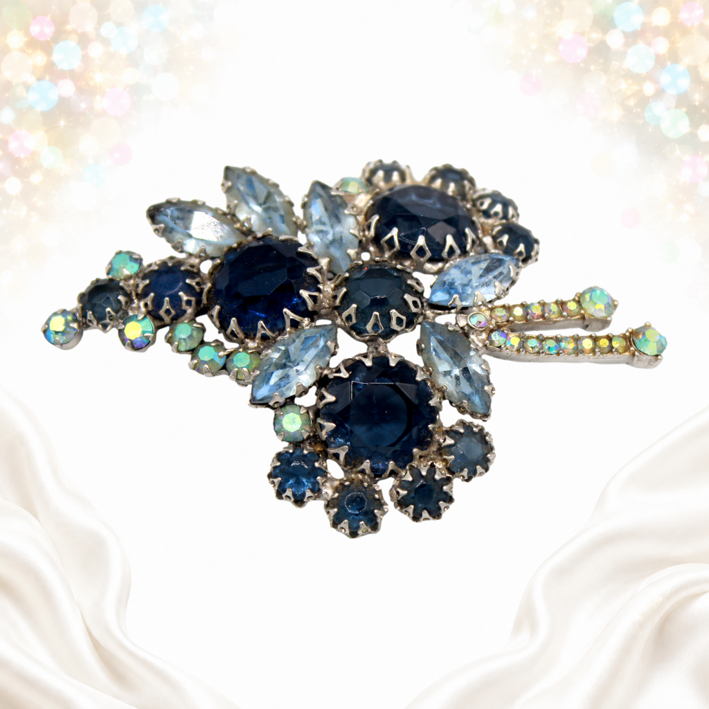 Vintage Juliana blue multi-prong rhinestone brooch, angled view