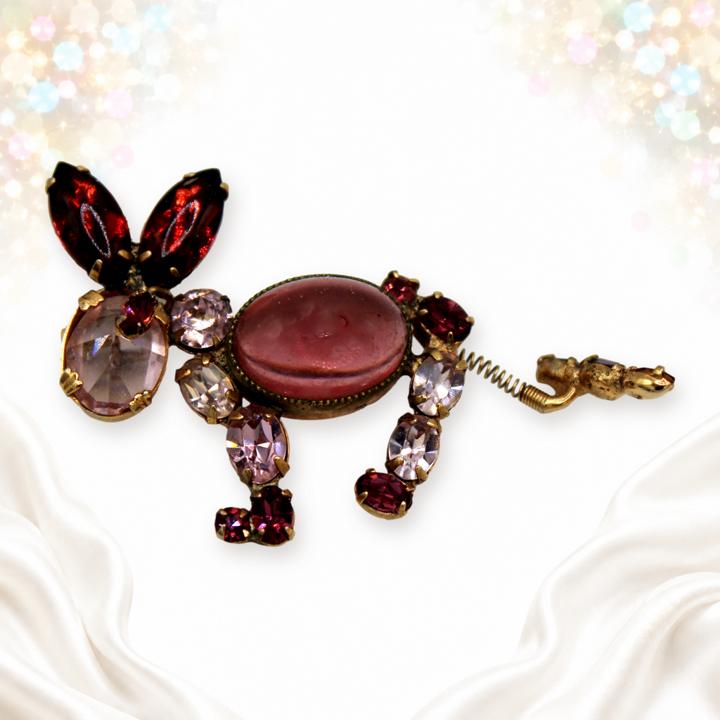 Unsigned Schreiner donkey rhinestone brooch at a low angle showing stones and spring