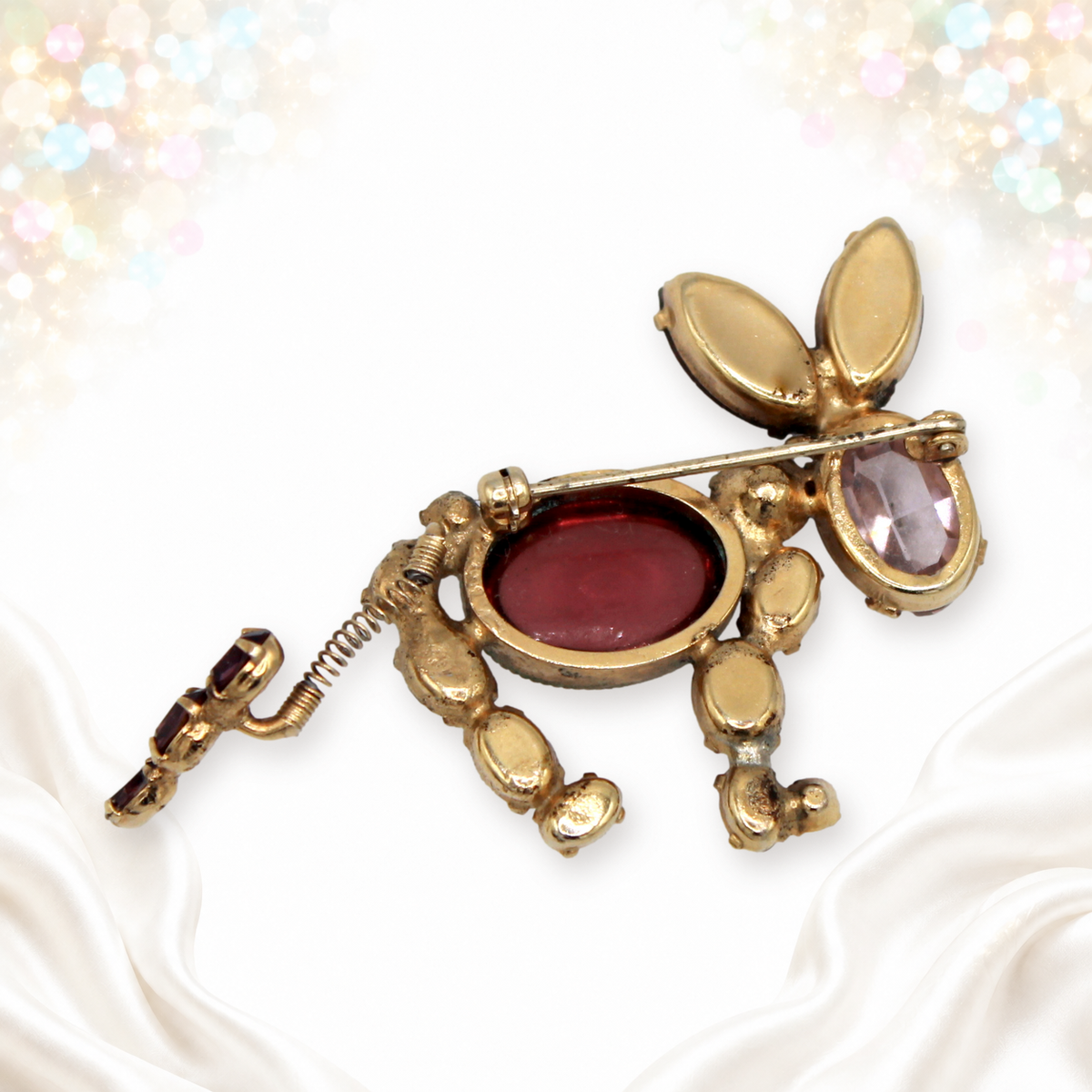 Back of unsigned Schreiner donkey brooch showing pin and stretched tail spring