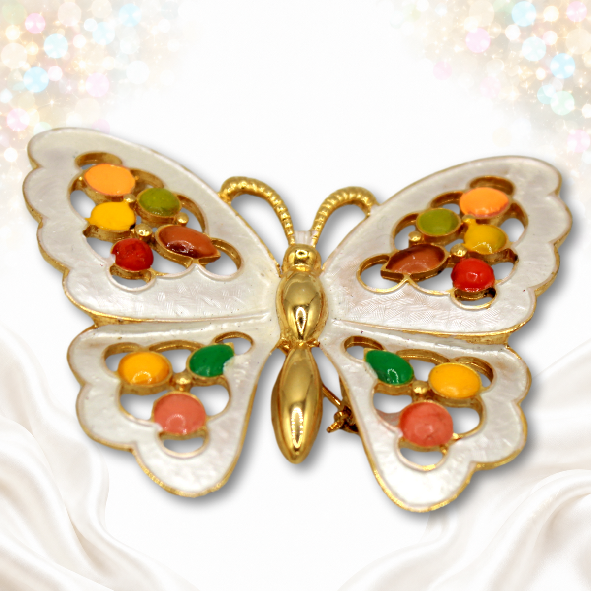 Juliana white textured enamel butterfly brooch with multicolored epoxy dots, angled view
