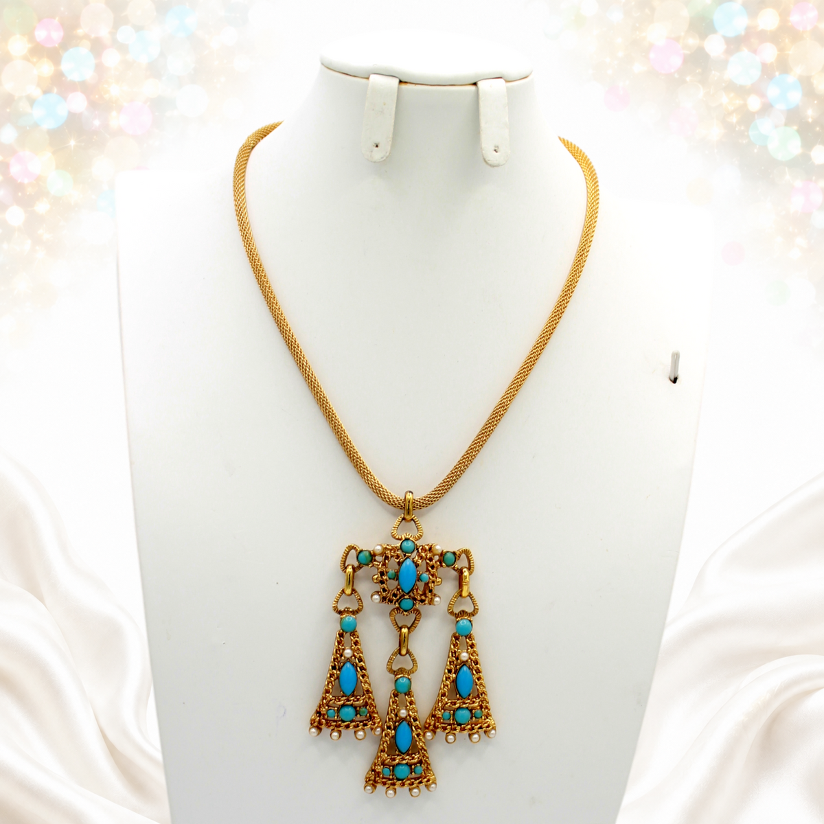 Full front of Egyptian Revival-style pendant necklace with woven gold-tone chain