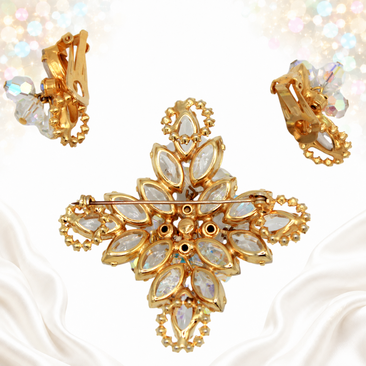 Reverse of Juliana Maltese cross brooch and clip earrings showing open-backed navette settings and fastenings