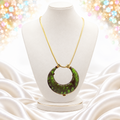 Juliana green crescent heat-formed necklace shown on white jewelry bust