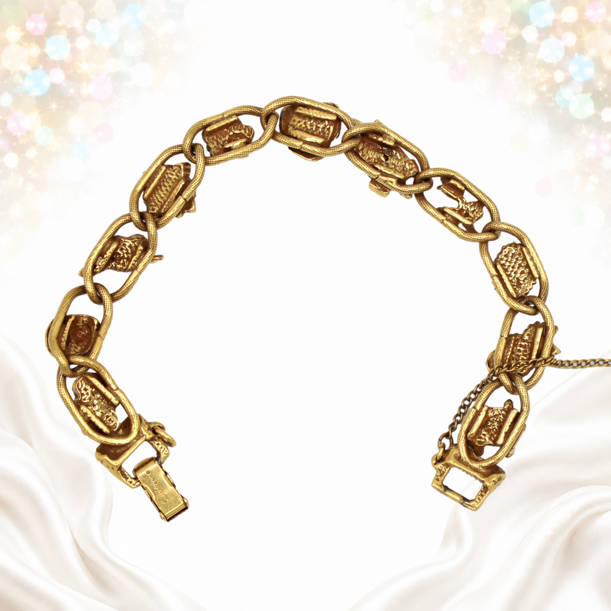 Reverse of the Goldette figural bracelet showing the linked construction and clasp