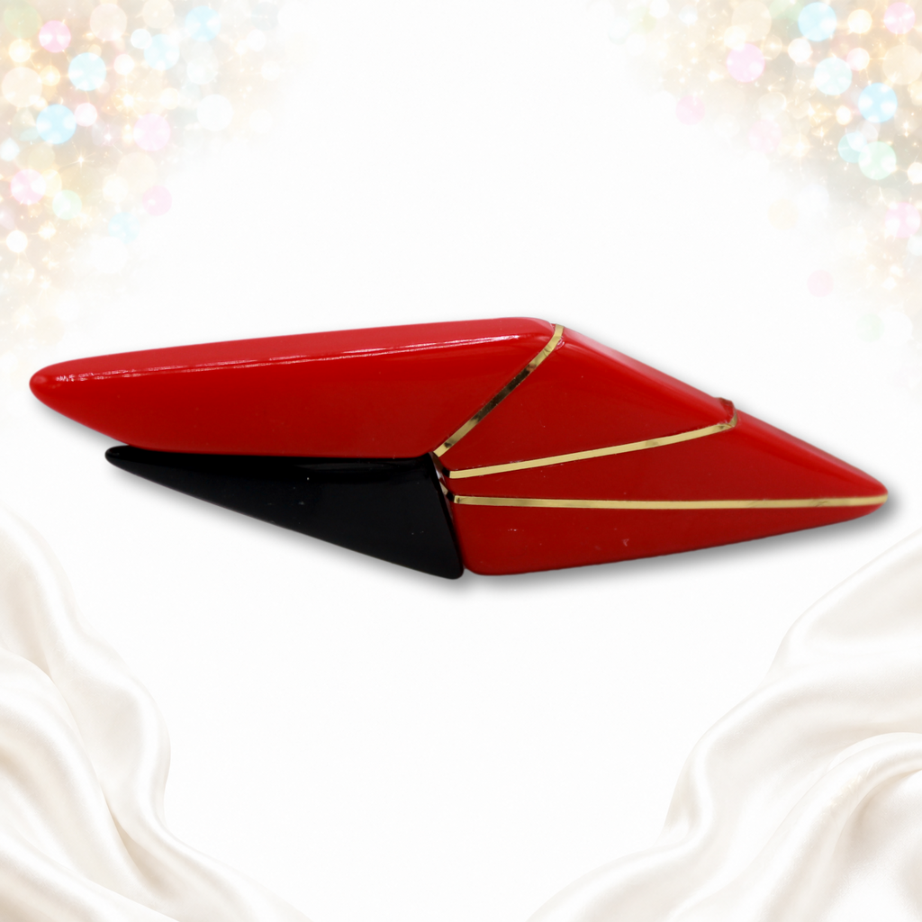 Vintage red and black geometric plastic Art Deco revival brooch with flexible gold-colored inset strips