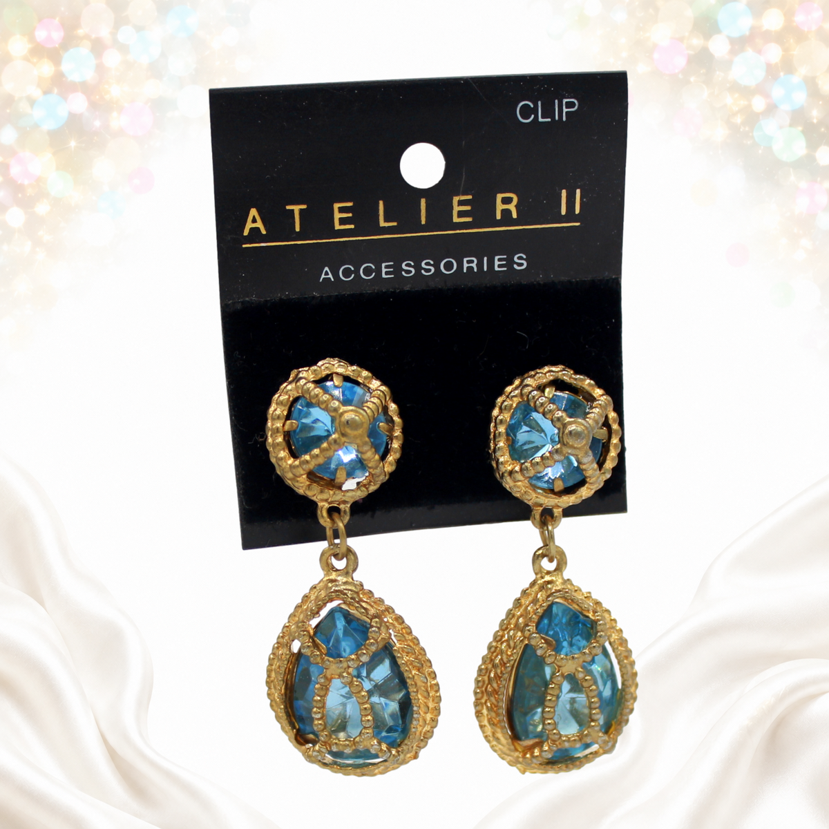 Juliana sky-blue caged earrings on original Atelier II card