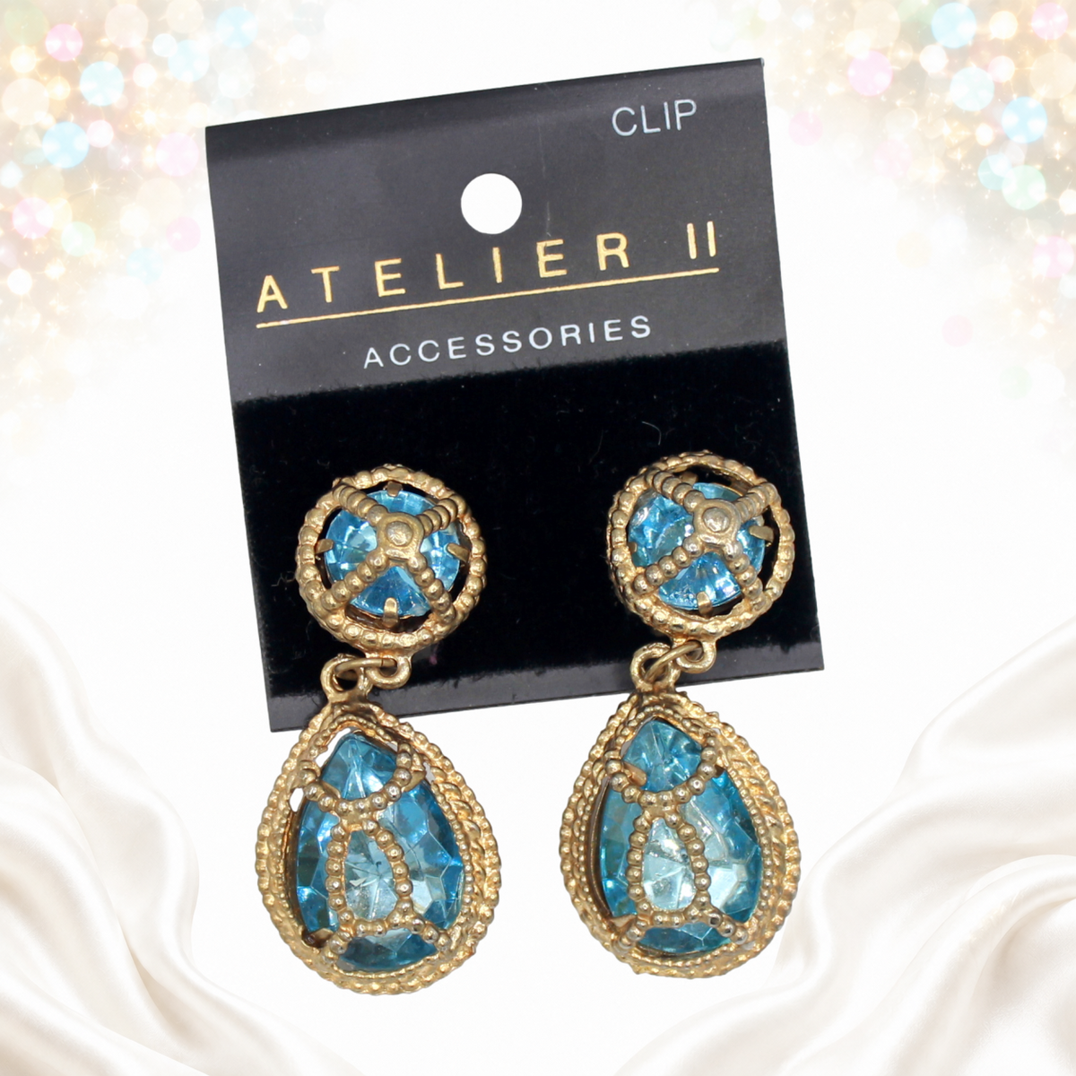 Juliana sky-blue caged earrings on original Atelier II card