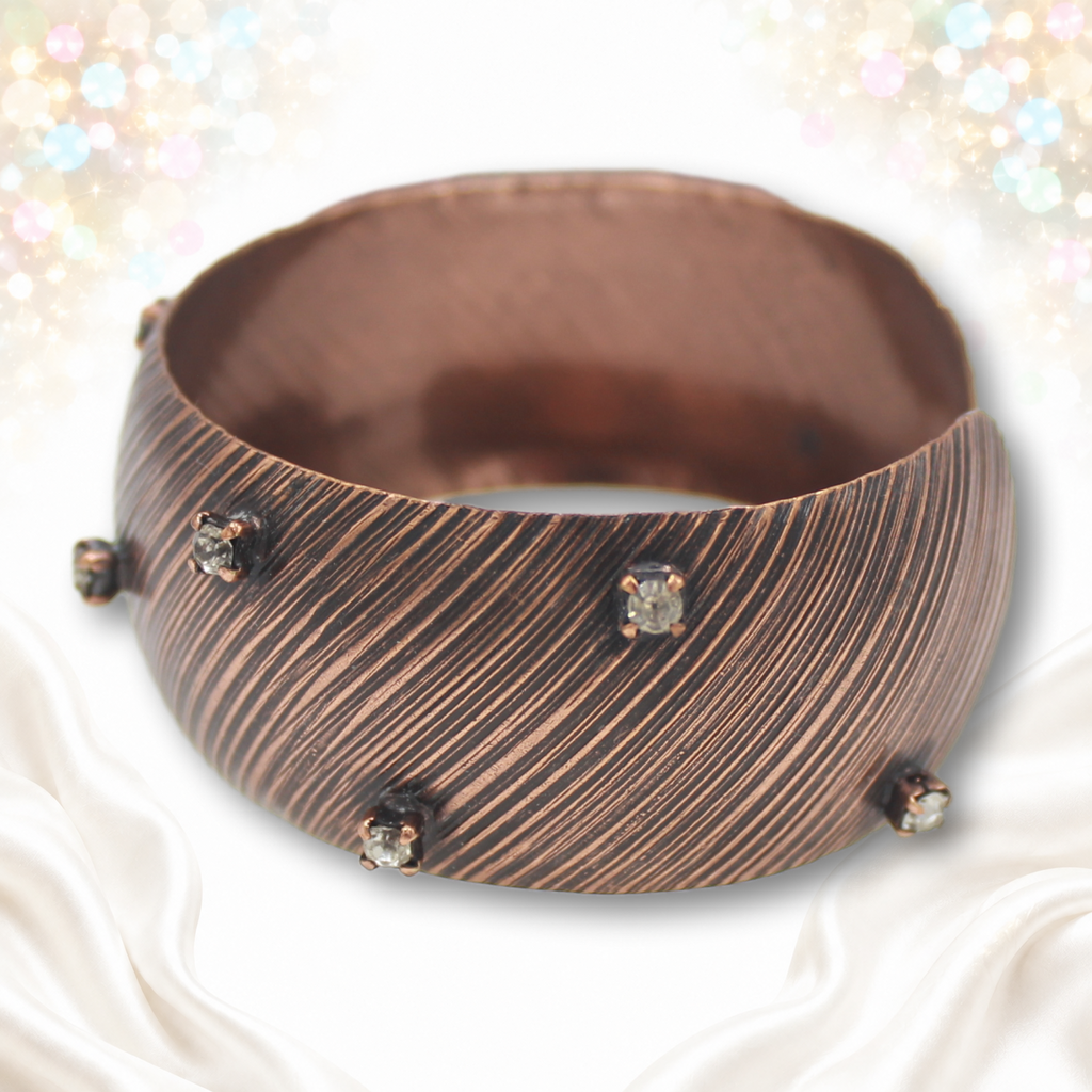 Angled front view of Juliana copper-tone striped cuff IIJJ#9774