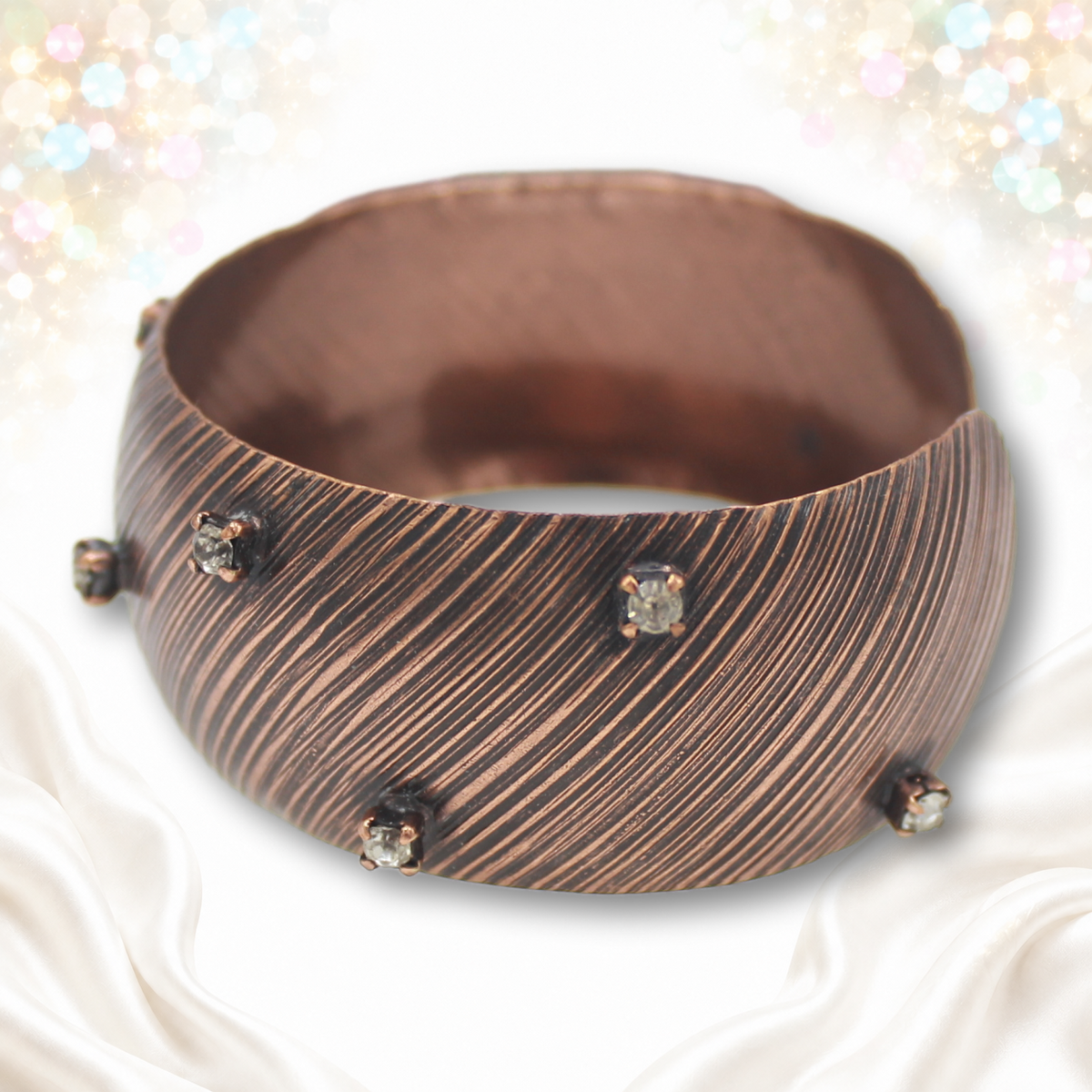 Angled front view of Juliana copper-tone striped cuff IIJJ#9774