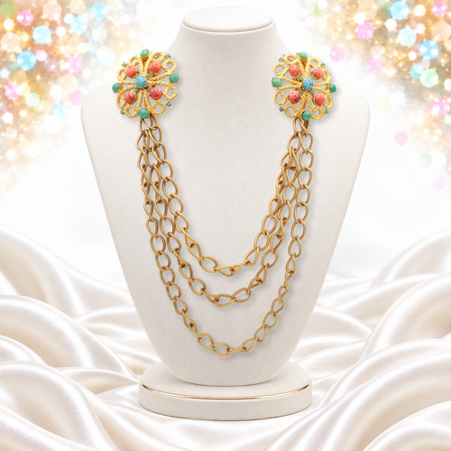 Juliana triple swag sweater clip with faux coral jade and turquoise cabochons on a white bust
