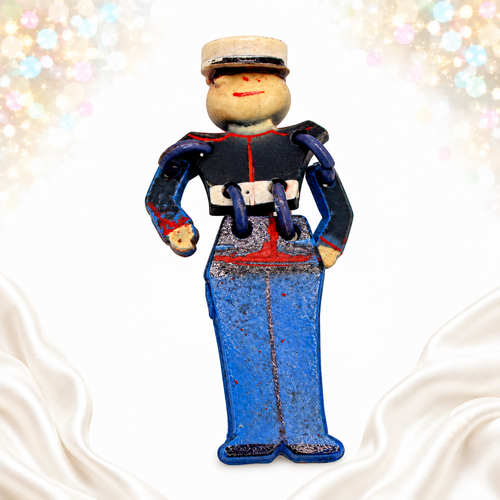 Vintage articulated plastic soldier brooch angled front view