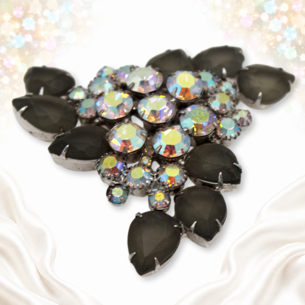 Angled side view of Juliana brooch with layered aurora borealis rhinestones and gray pears
