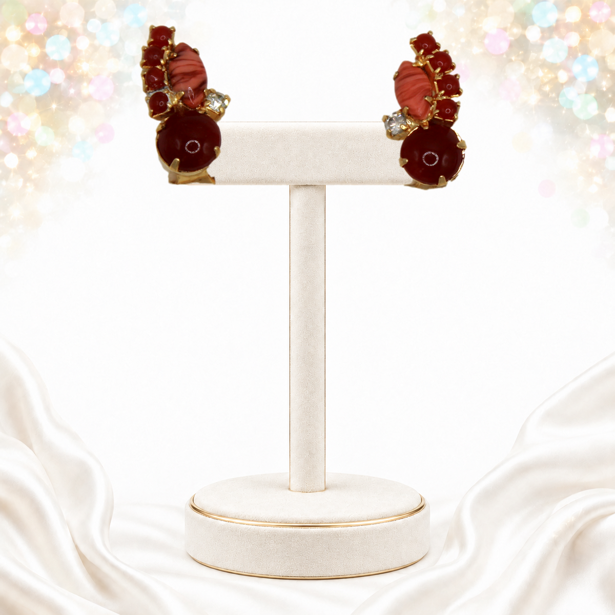 Gold-tone Juliana faux carnelian and coral clip earrings on display stand