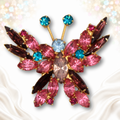Front view of pink and teal rhinestone butterfly brooch