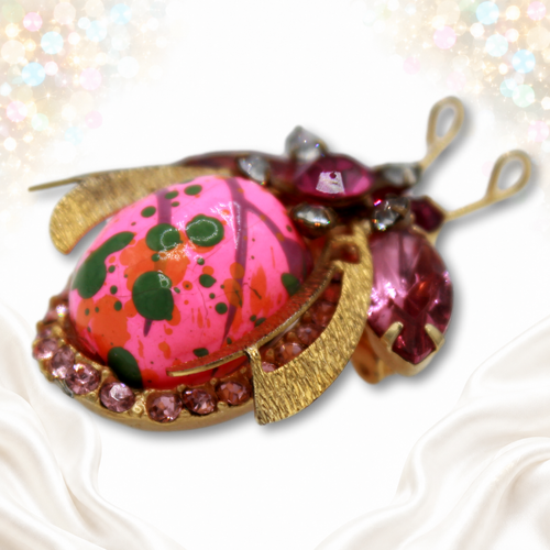 Side view of domed painted wood bead Juliana beetle brooch