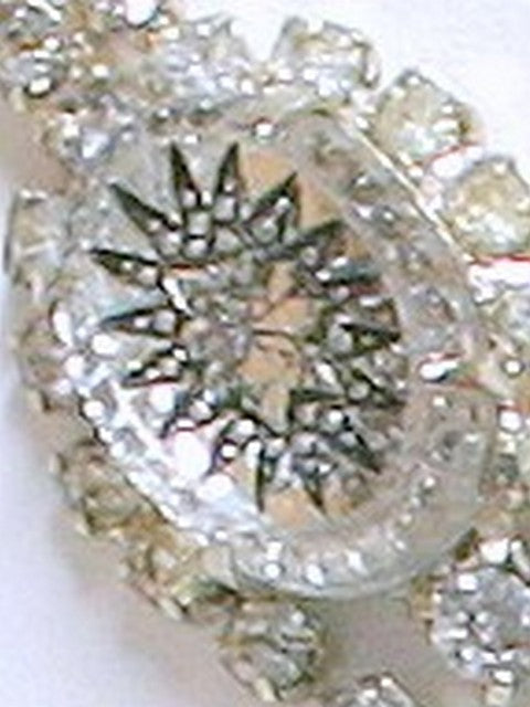 Closeup reference showing black star detail in oval glass stone