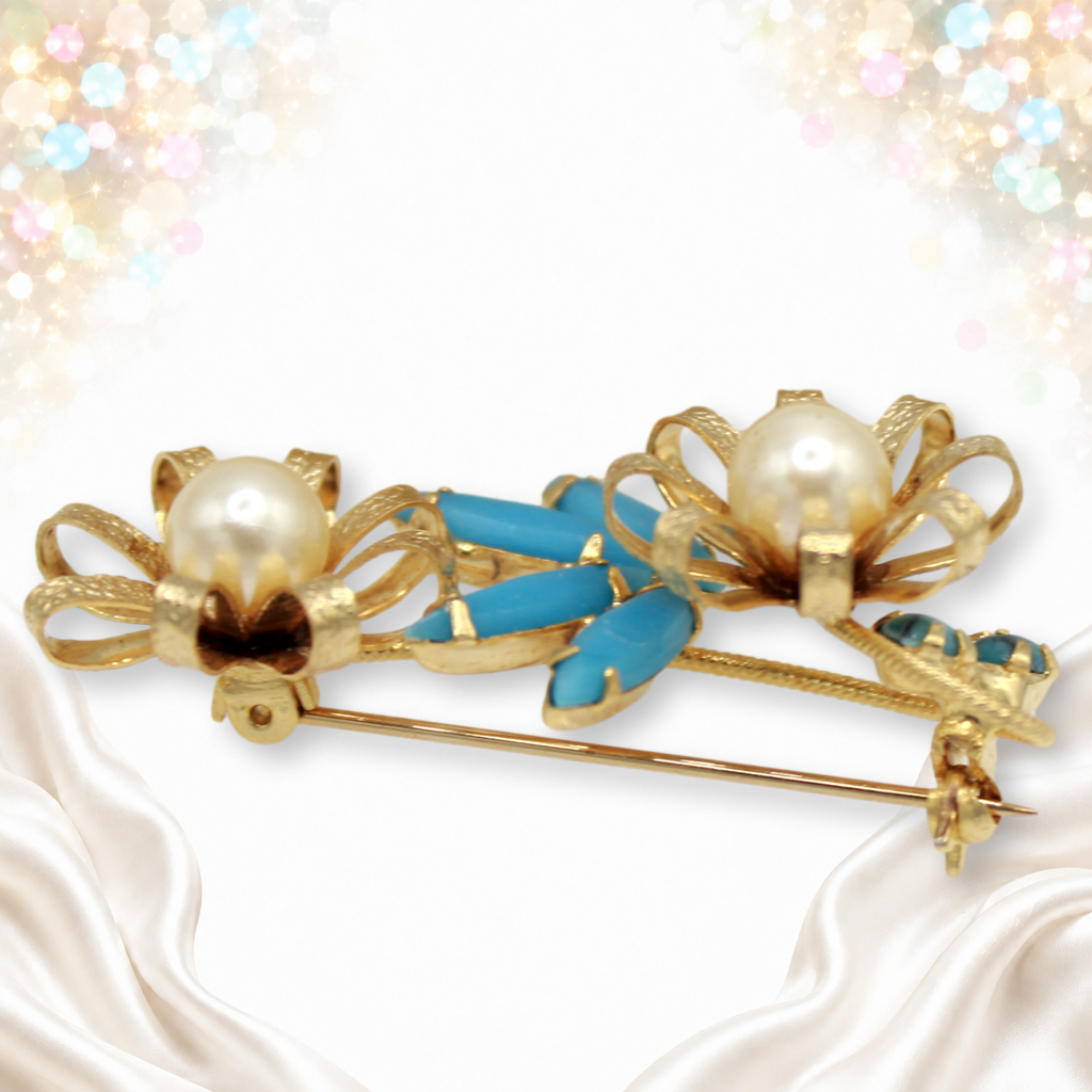 Brooch side view showing looped petals and twisted metal