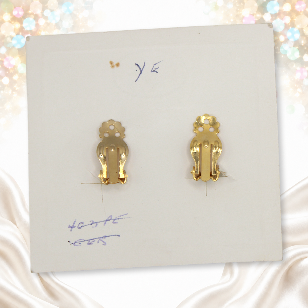 Reverse of original Juliana card with gold-tone clip backs and handwritten notations